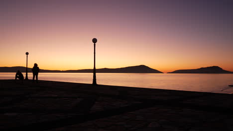 epic shot of a purple sunset view from a pier