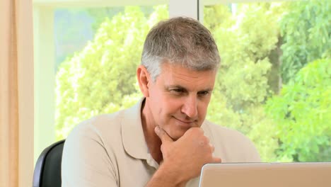 Relaxed-man-working-on-his-laptop