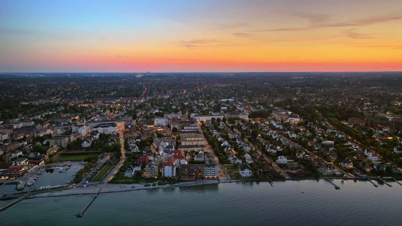 Aerial drone view of Osterbo Nord, Nordhavn harbour area at the coast of the Oresund at sunset