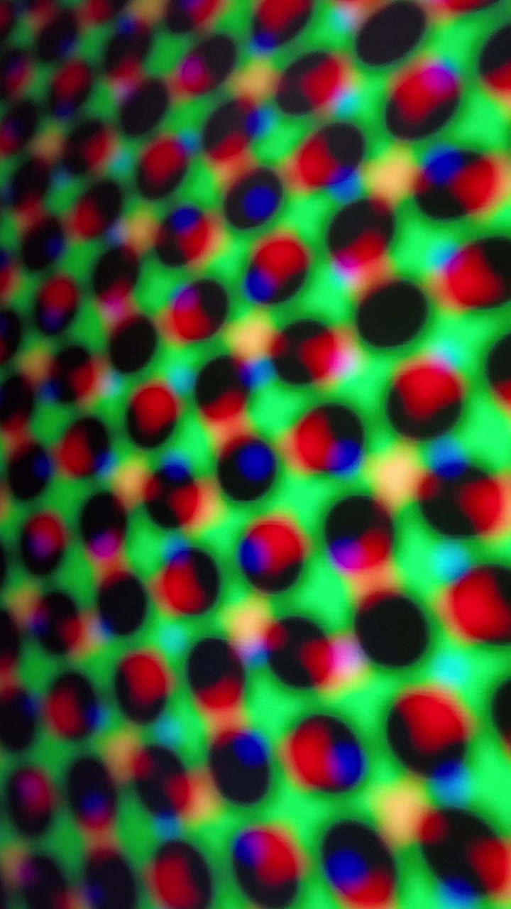 Abstract Motion Background with Shifting Colorful Polka Dot Pattern