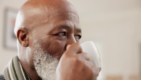 Mature,-man-and-thinking-with-coffee-in-home