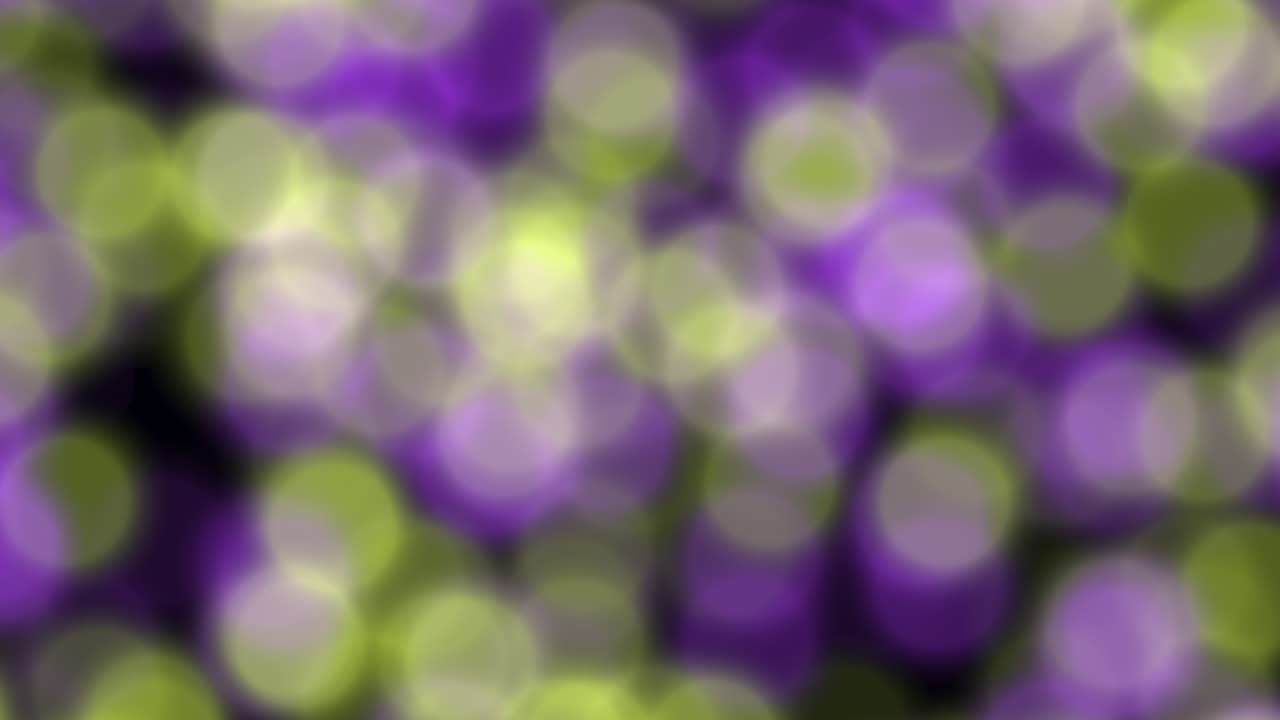 Mystical swirl abstract pattern of purple and green circles creates a mesmerizing blur