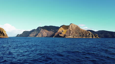 Rugged-shore-of-Bay-of-Islands-in-New-Zealand,-beautiful-landscape,-slow-motion