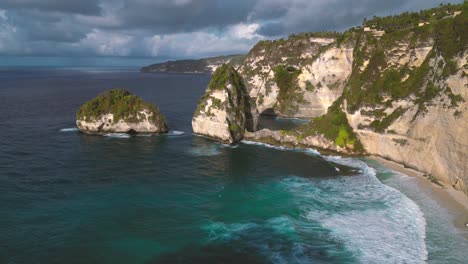 Beautiful-aerial-view-of-Diamond-Beach-in-Nusa-Penida-at-sunrise---Bali,-Indonesia