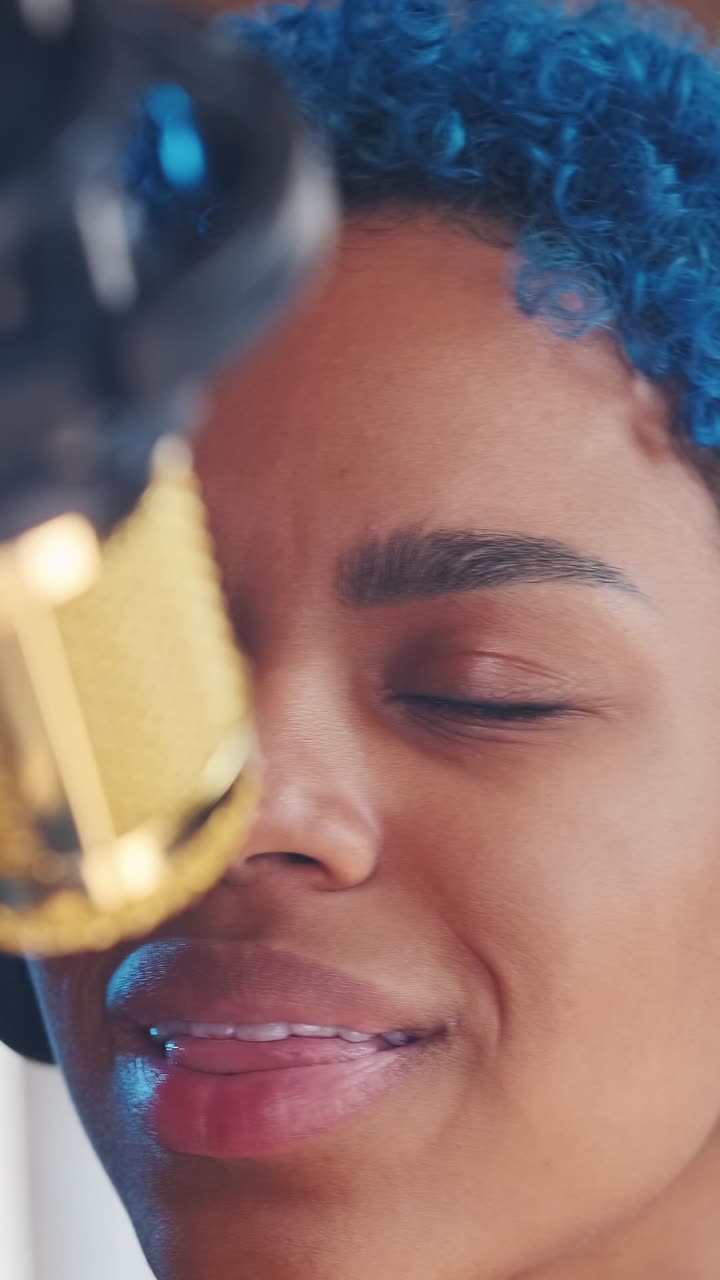 Creative session in studio with vibrant blue hair and expressive energy