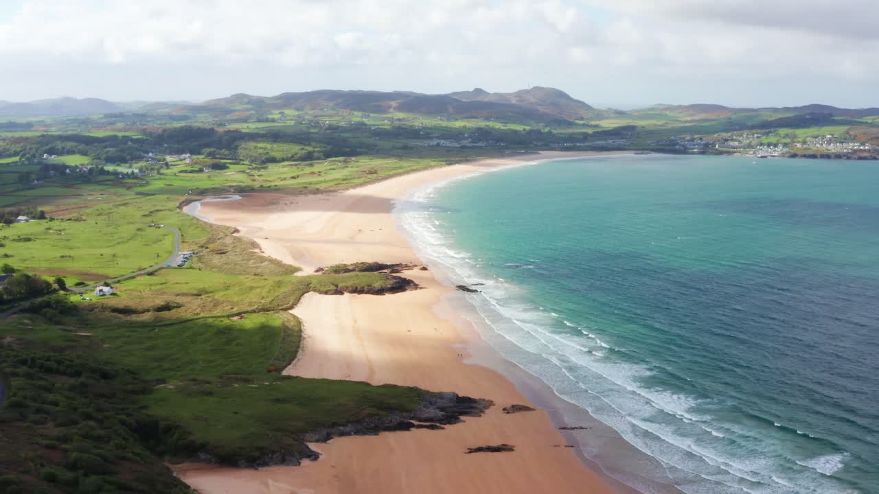 Aerial View of Ballymastocker Beach with Walkers and Cloud Shadows