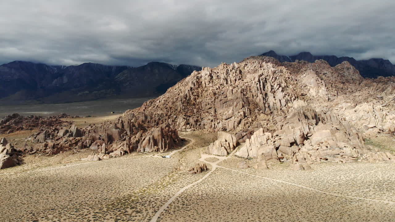 Aerial shot of a dramatic rugged landscape over the Alabama Hills and Mount Whitney in California USA