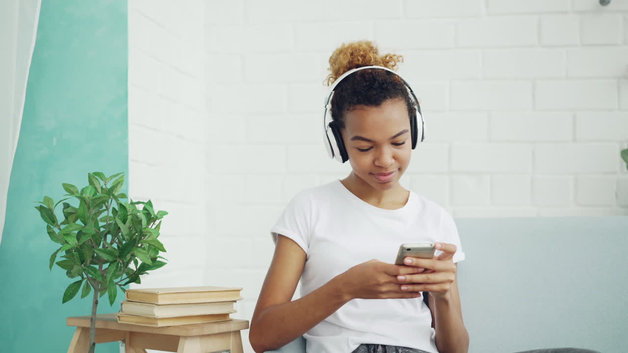 Young Woman Relaxing with Headphones and Phone