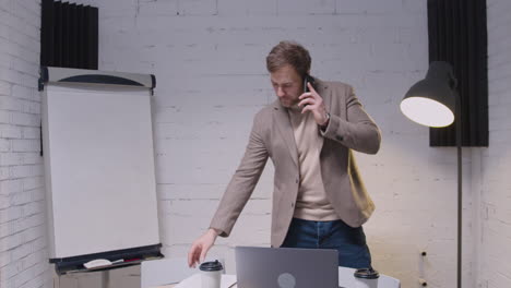 businessman talking on mobile phone in the office