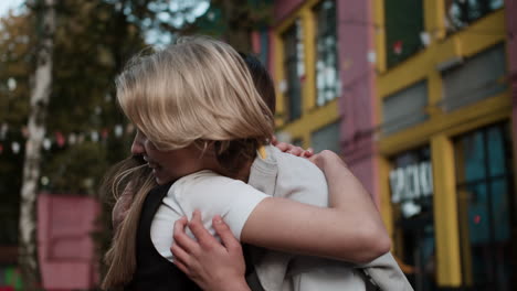 teenage boy and girl hugging