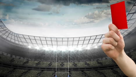 animation of referee holding red card on rugby pitch in sports stadium