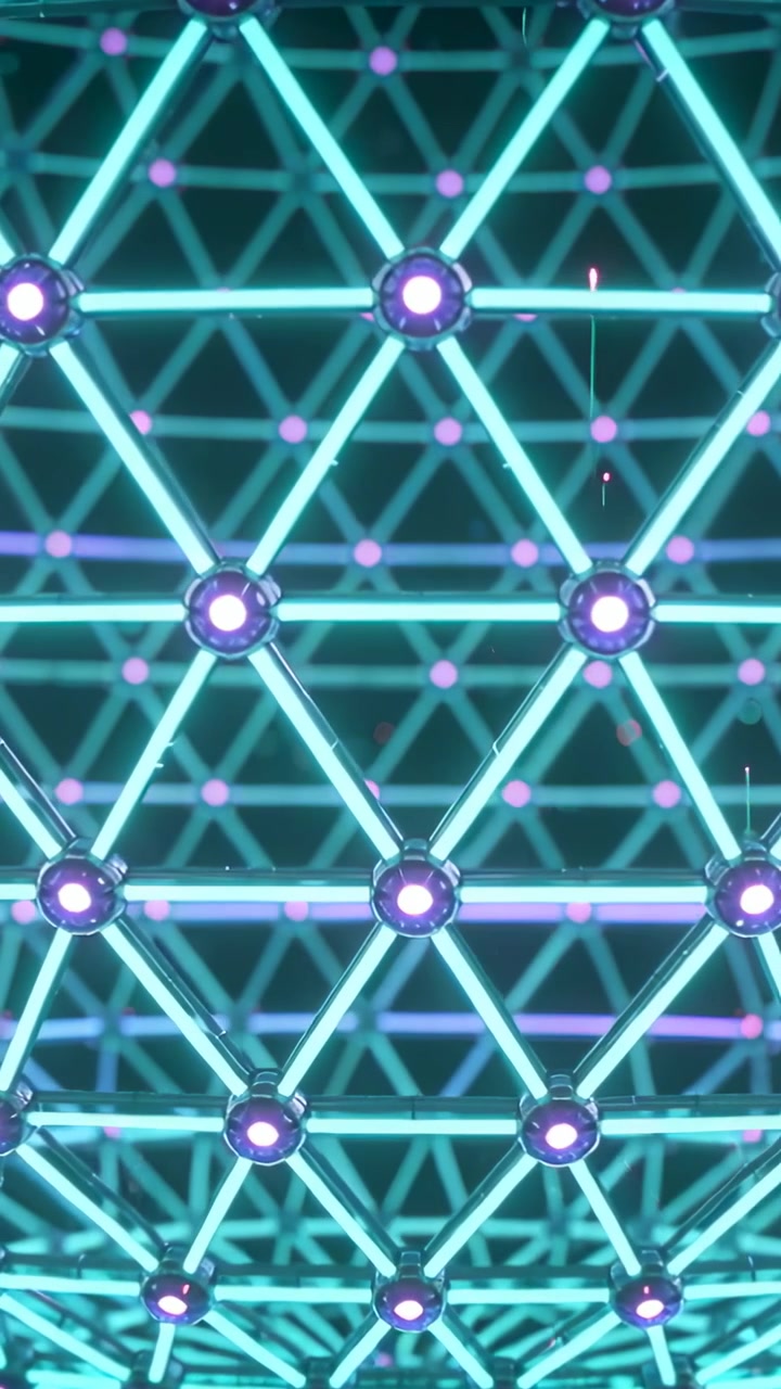 Vertical video: Moving camera showing lattice depth in dark room, with cyan rods, purple nodes