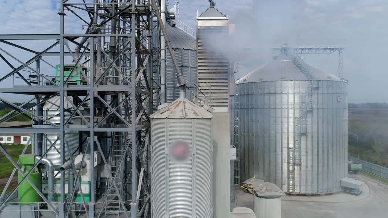 Big factory metal constructions. Huge industrial metal containers. Aerial view.