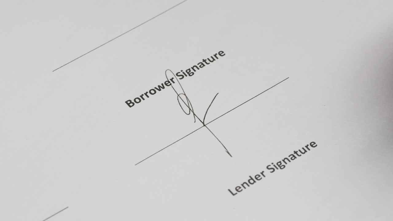 Hand Signing Borrower Signature on a Document