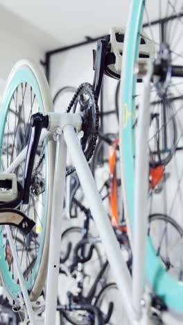 mechanic repairing bicycle in workshop