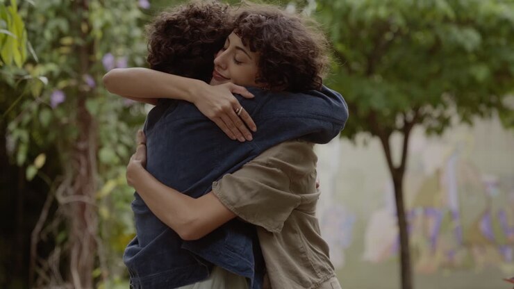 Two people embracing outdoors