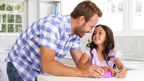 Cute-father-playing-with-his-daughter-