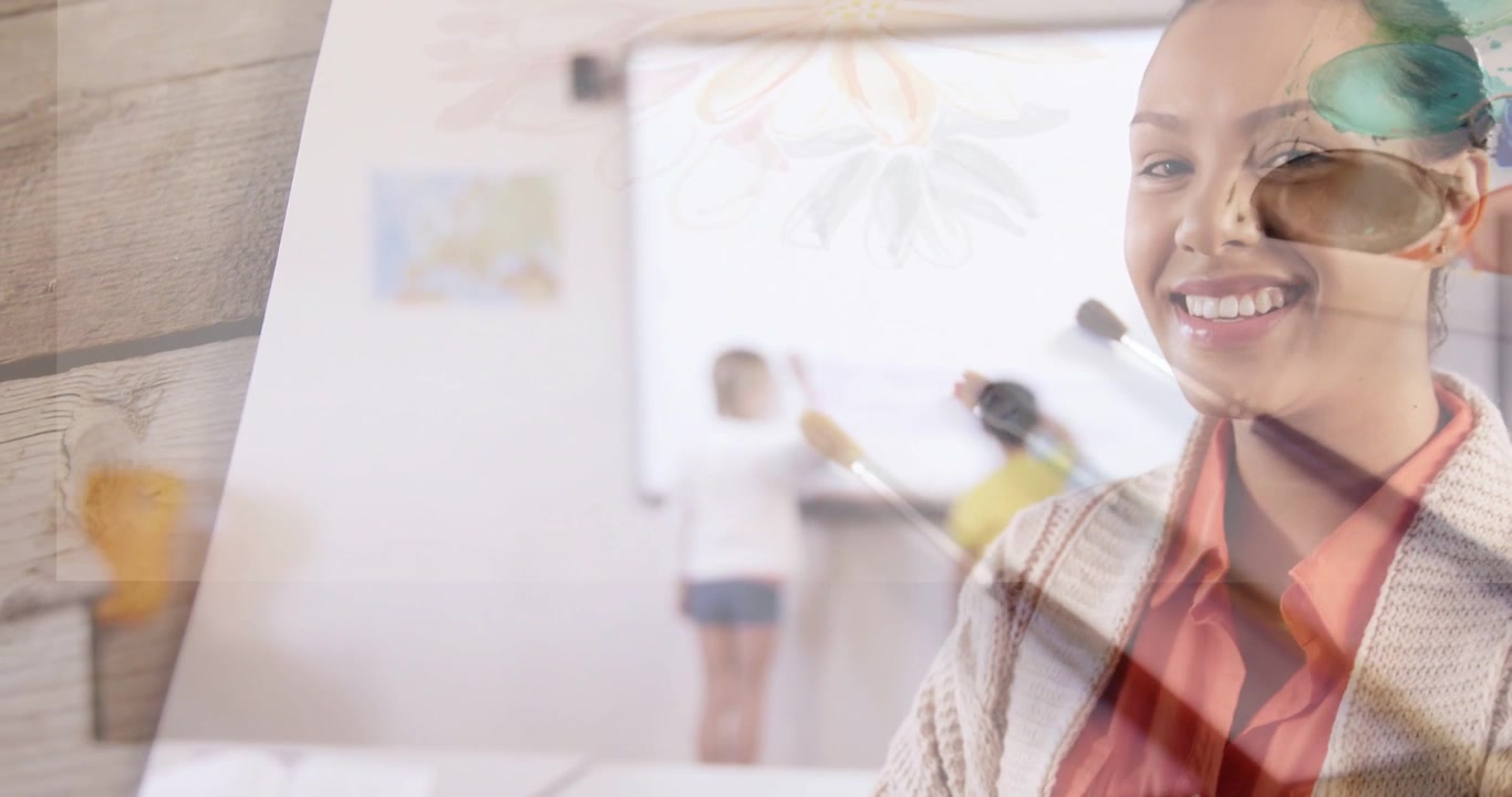 Smiling art teacher coral top teaching kids at board as camera panning, palette brushes, copy space
