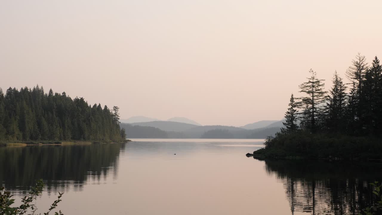 Wide shot of a lake at sunrise