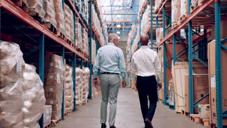 businessmen inspecting warehouse inventory
