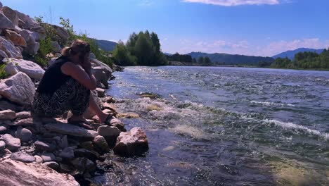 A Serene Moment by the Riverside: Reflecting on Nature&#039;s Beauty and Tranquility Amidst Flowing Water and Scenic Landscapes