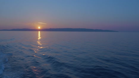 wide angle shot of magnificent panorama at sunset of the sea in greece, the cruise has just left the port of piraeus direction to amorgos