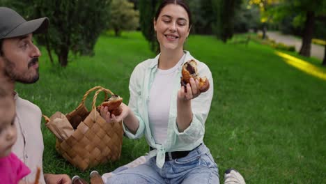 a family enjoys a picnic in the park