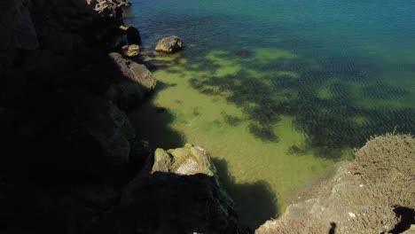 captures-tranquility-beneath-towering-cliffs,-where-the-Azov-Sea-exudes-serenity