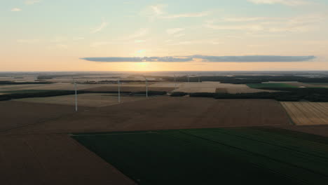 Sunset over Wind Farm and Agricultural Fields