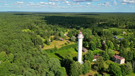 Aerial-View-of-Miķeļtornis-Lighthouse-and-Surrounding-Village