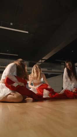 contemporary dance performance with red fabric