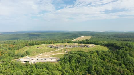 the fort of douaumont in the middle of the countryside and green forests towards verdun, in the meuse, in lorraine in the great east of france, in summer and by drone.