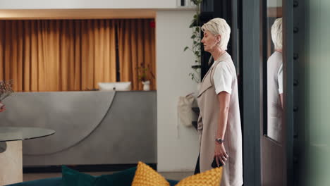 Woman,-hotel-and-reception-lobby-with-phone