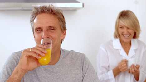 smiling couple having breakfast