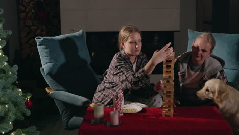 mother and daughter enjoying a christmas game night