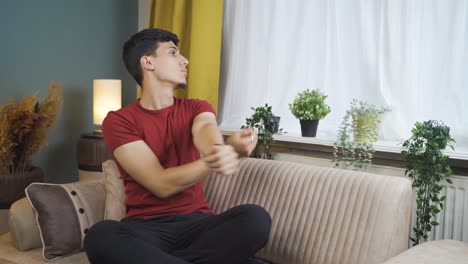 Man-doing-yoga-outside-in-front-of-the-window.