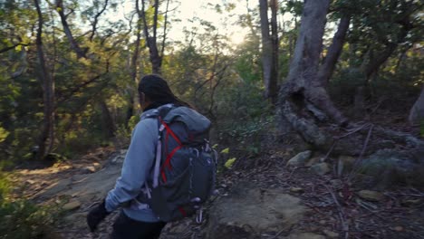 indigenous australian girl hiking into the bush in the blue mountains national park, nsw australia