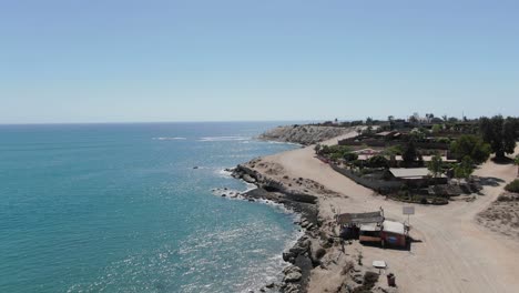 Aerial-view-Moving-forward-shot,-Scenic-view-of-the-beach-and-coastline-of-San-Juanico,-California-Sur,-Mexico,-on-a-bright-sunny-day