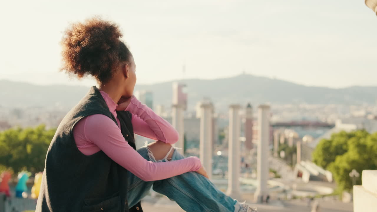 Woman Contemplates Barcelona Cityscape