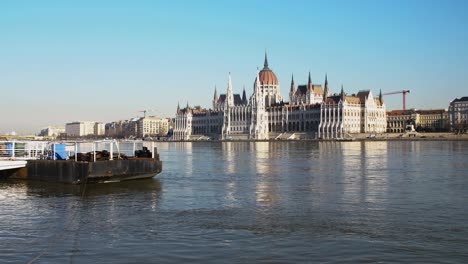 budapest city center view with parliament building and danube river on a sunny day, gothic architecture, distant wide panoramic shot