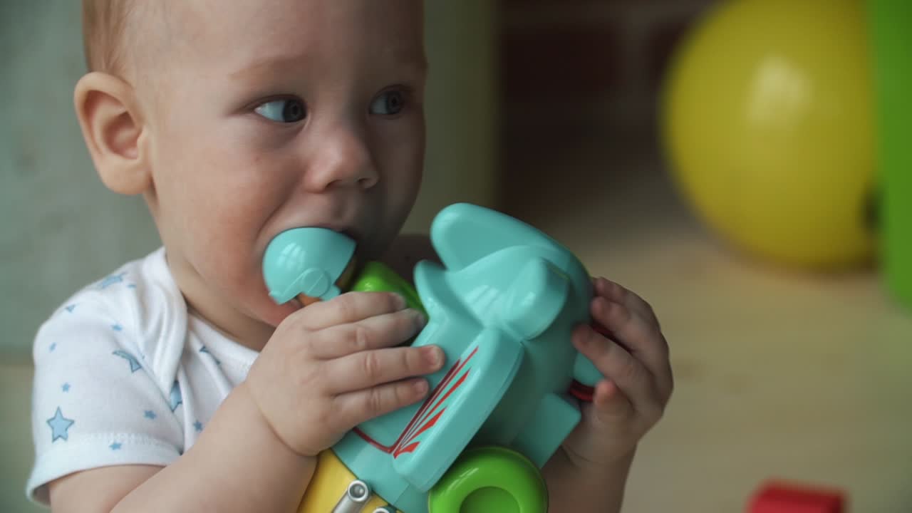 Baby playing with a toy