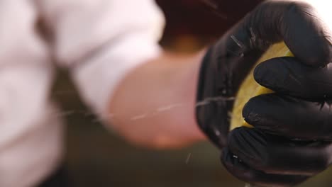 chef squeezing lemon