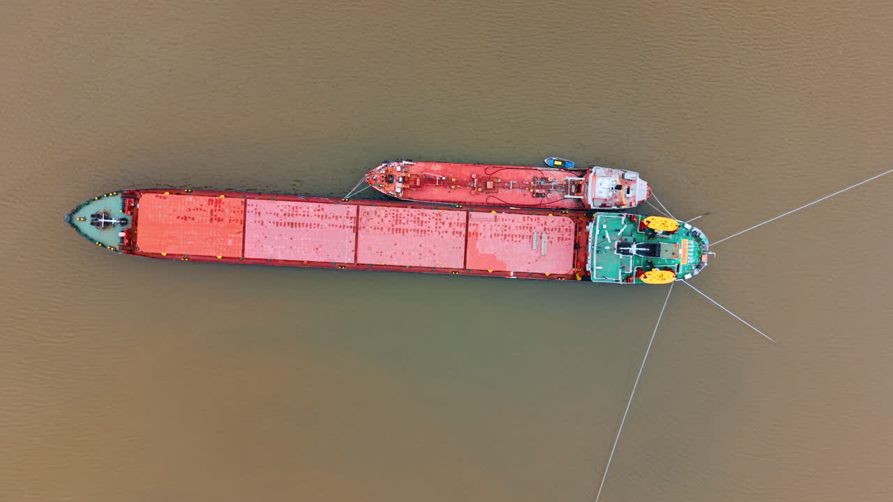 Top down view of two ships connected by lines. Showing the stern of a ...