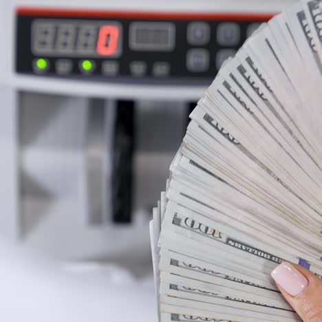 closeup of business woman hand hands counting us dollar cash