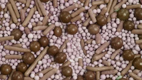 a detailed macro view of assorted candies, featuring vibrant colors and varied shapes, creating a playful and sweet visual experience