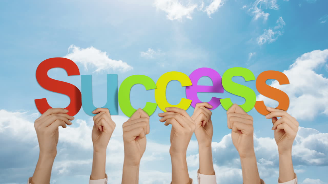 Hands holding up success