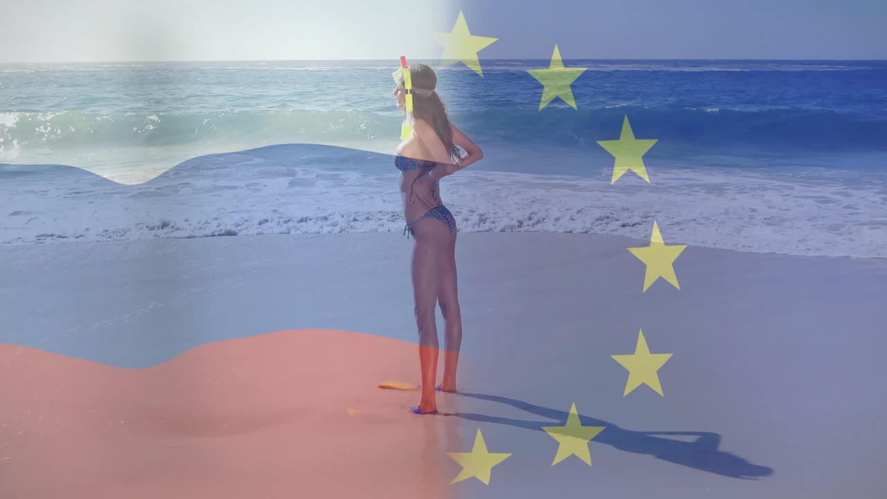 Walking on beach, woman carrying European Union flag with animation overlay