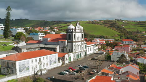 aerial drone shot of old church of horta town in faial island, azores - portugal