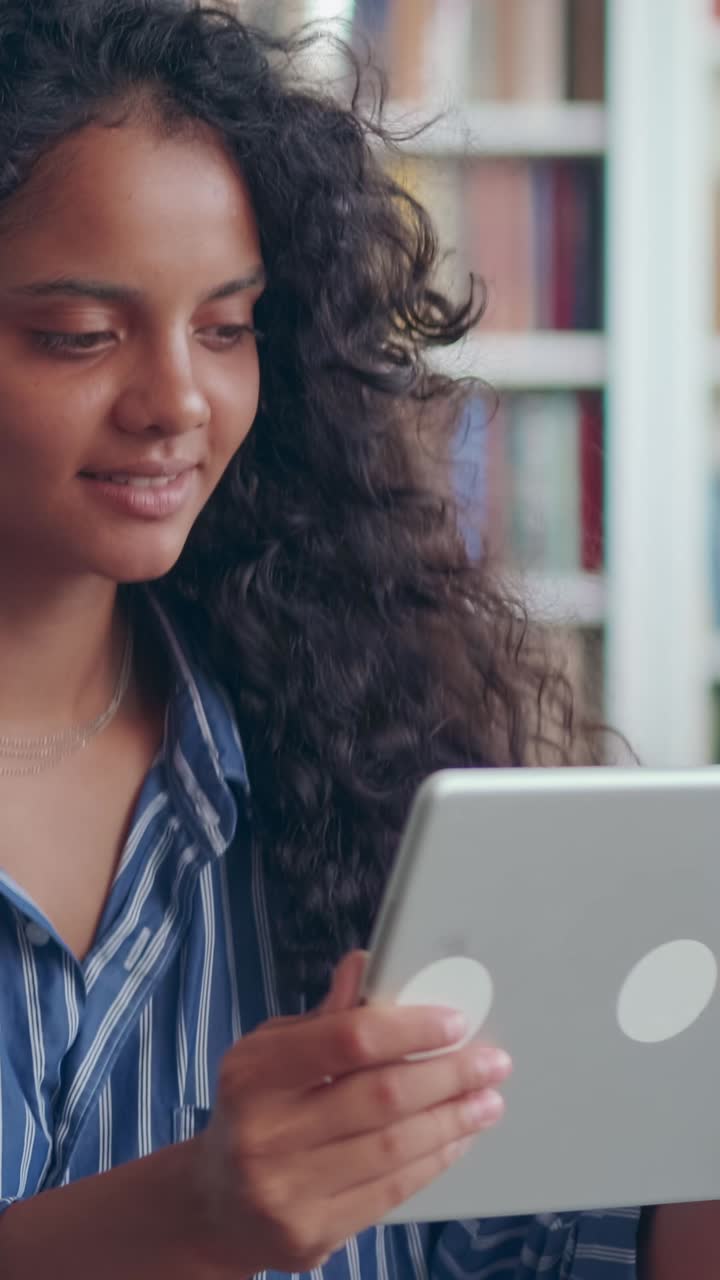 Woman smiling and waving during online conversation in india