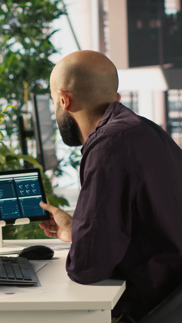 Vertical video Office clerk working to hit key performance targets for revenue